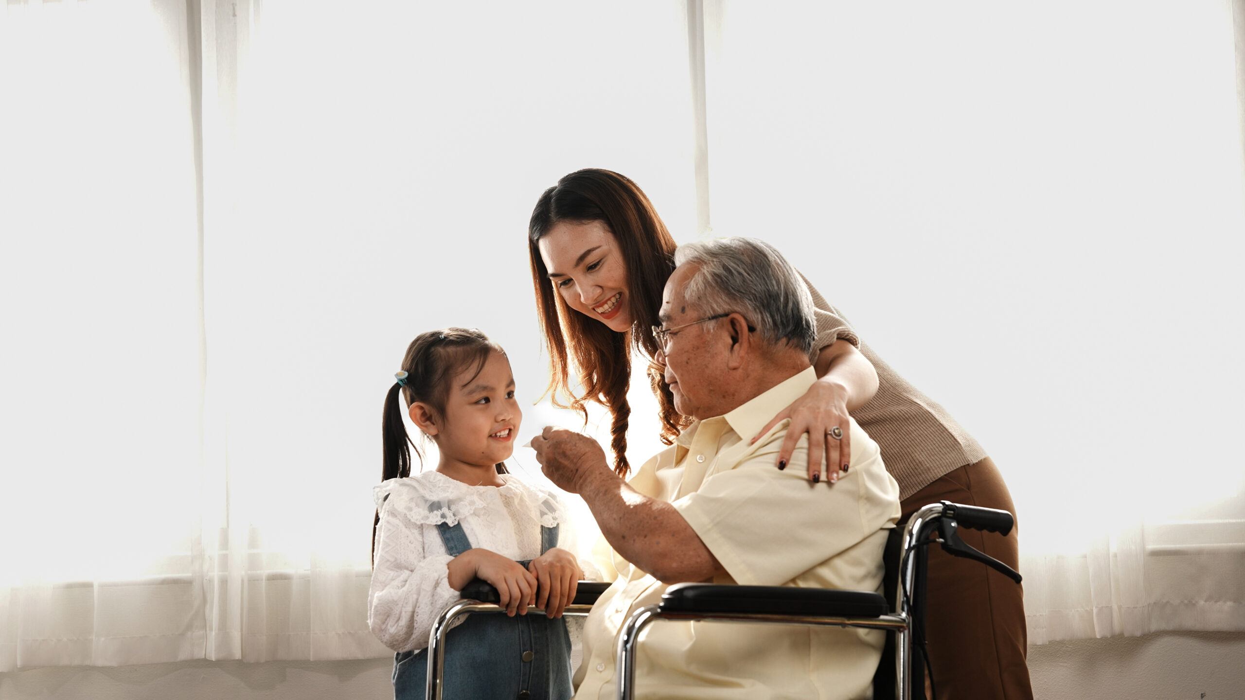 Family smiling together at home representing family healthcare Malaysia