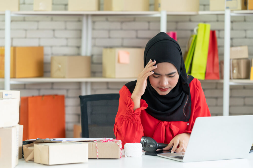 Stressed SME owner at her desk