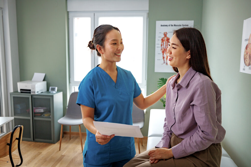 Healthcare worker consulting a patient in a clinic amid Medical inflation Malaysia 2026