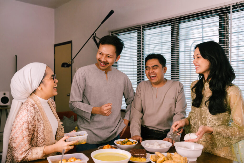 Young adults sharing a meal before Hajj preparations