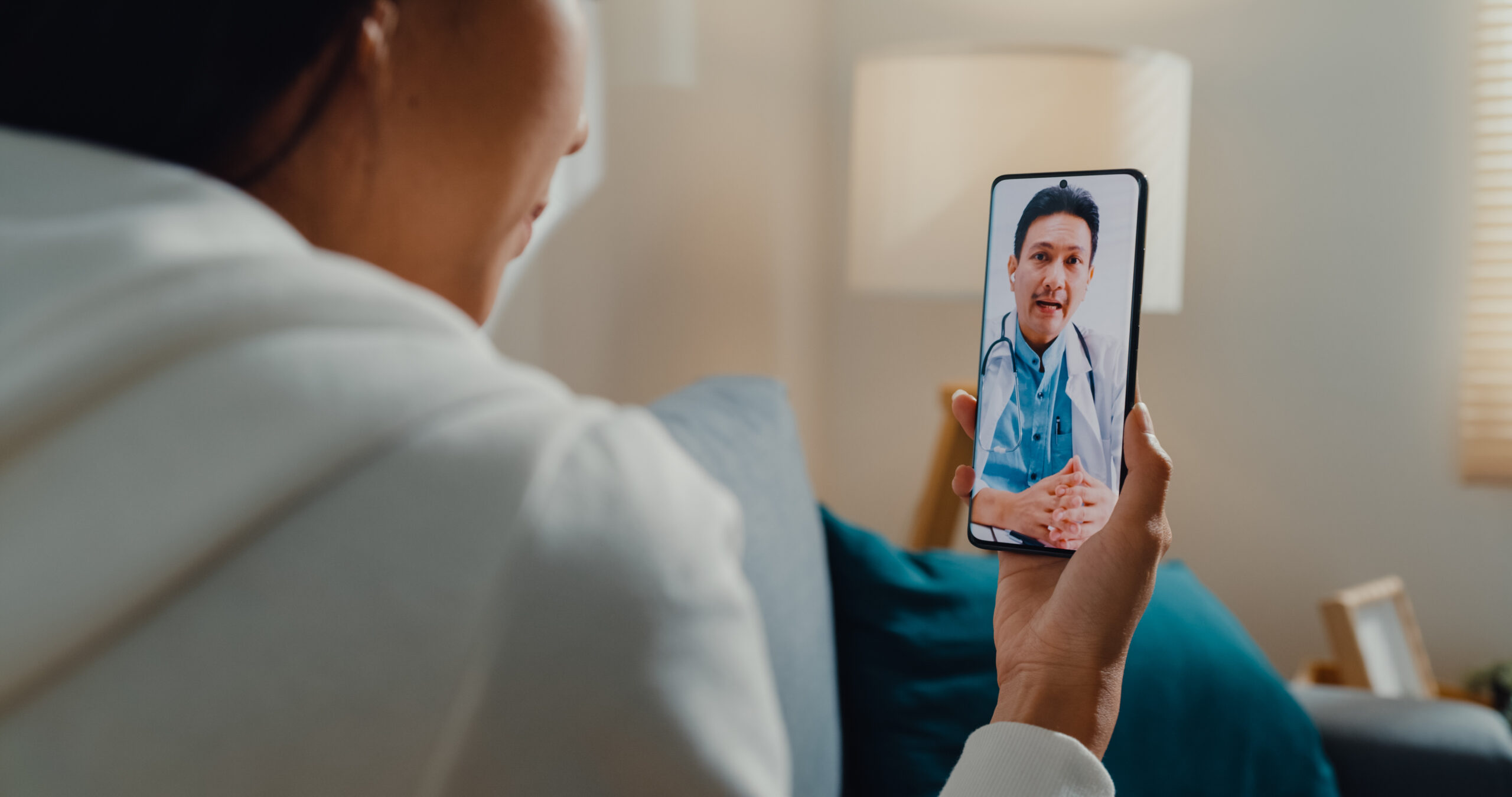 Patient having a telemedicine video consultation with a doctor