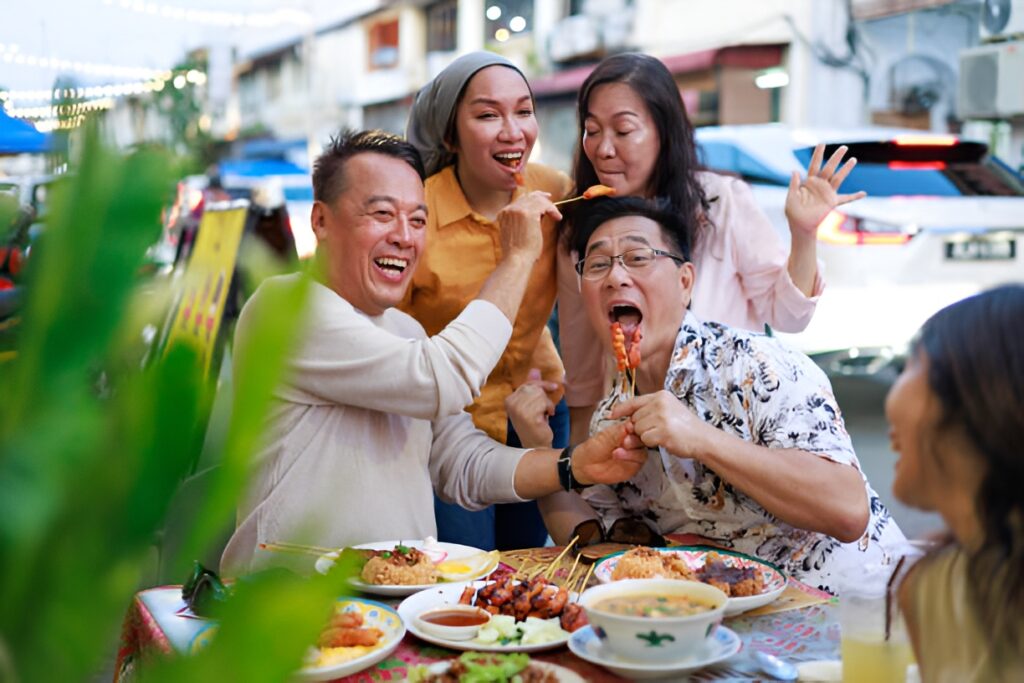 Family enjoying skewers together while travelling